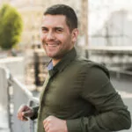 Man leaning against railing